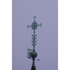 Cross with arrow tips and a solar disc in the center